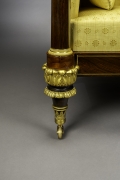 Box Sofa, about 1820. Attributed to Duncan Phyfe (1770–1854), New York. Rosewood and mahogany, partially paint-grained rosewood and gilded, brass line inlay, gilt-brass sabots and castors, and upholstery, 33 3/4 in. high, 82 in. long, 27 1/4 in. deep (detail).