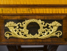 Card Table with Lyre Base, about 1815. Philadelphia. Mahogany, with gilt-brass paw toe caps and castors, strings for the lyres, and gilt-brass and ormolu mounts 28 1/2 in. high, 35 in. wide, 17 1/2 in. deep (at the top), 18 in. deep (at the castors). Detail of ormolu mount on table skirt at center.