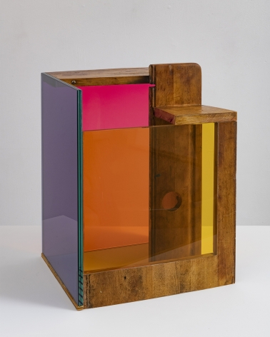 a sculpture by Sarah Braman of a cabinet draw fused with multi-colored glass panels