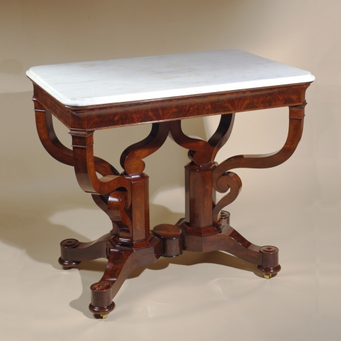 Rectangular Center Table, about 1840. Possibly Duncan Phyfe. New York Mahogany, with gilt-brass castors, and white marble top 31 1/4 in. high, 37 3/8 in. long, 25 7/8 in. wide