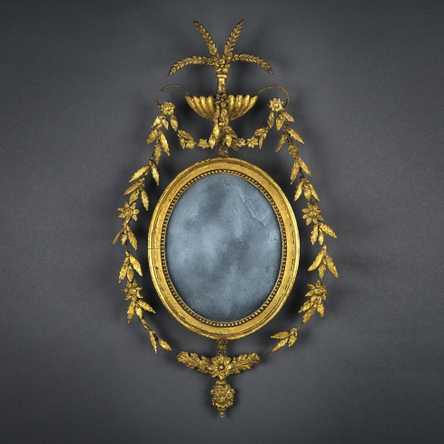 Oval Federal Mirror, about 1800. American, probably New England. Pine and iron wire, gessoed and gilded, with compo ornament and mirror 25 1/2 in. high, 14 1/2 in. wide.