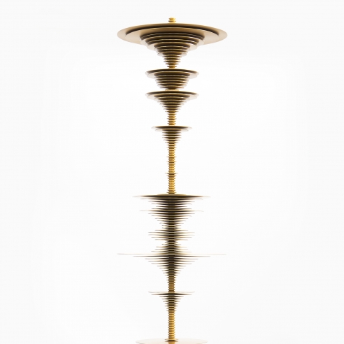 a sculpture by Elizabeth Turk of gold aluminum discs stacked and arranged to simultaneously resemble a Modernist abstraction and a sound wave