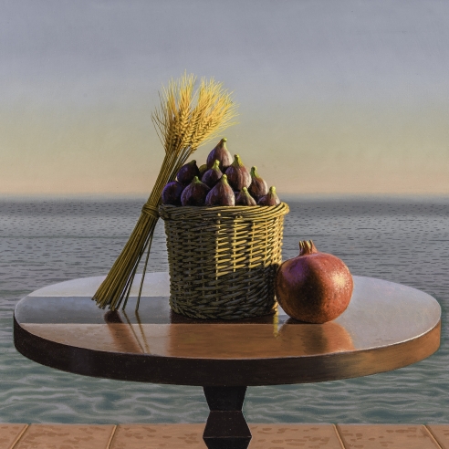 a tabletop still life of wheat, figs and a pomegranate by calm ocean water