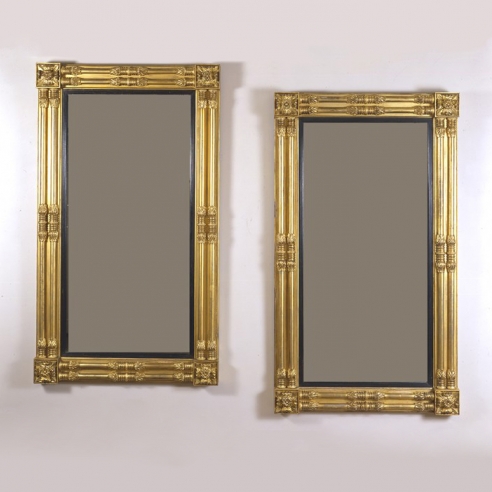 Pair Neo-Classical Pier Mirrors, about 1818. Attributed to John Doggett & Company, Boston, Eastern white pine, gessoed and gilded, with ebonized liners and mirror plate Each, 65 1/8 in. high; 37 1/2 in. wide.
