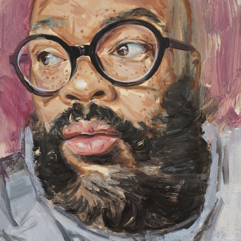 a portrait by James Everett Stanley of a dark-skinned man turning his head with round-rimmed glasses and a thick beard
