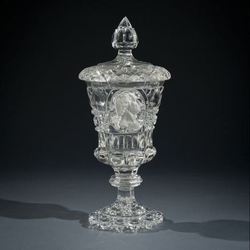"Clear Glass Covered Urn with Sulphide Portrait of George Washington," about 1825. French, probably Baccarat. Glass, blown and cut, with sulphide incrustation, 10 5/8 in. high